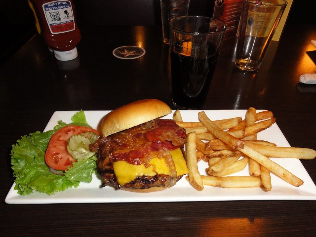 Ah dinner, a hickory burger and fries. It's a bacon cheese burger with tons of chipotle barbecue sauce.
